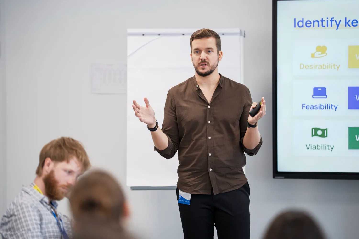 Olek presenting the desirability, feasibility and viability framework at a startup workshop