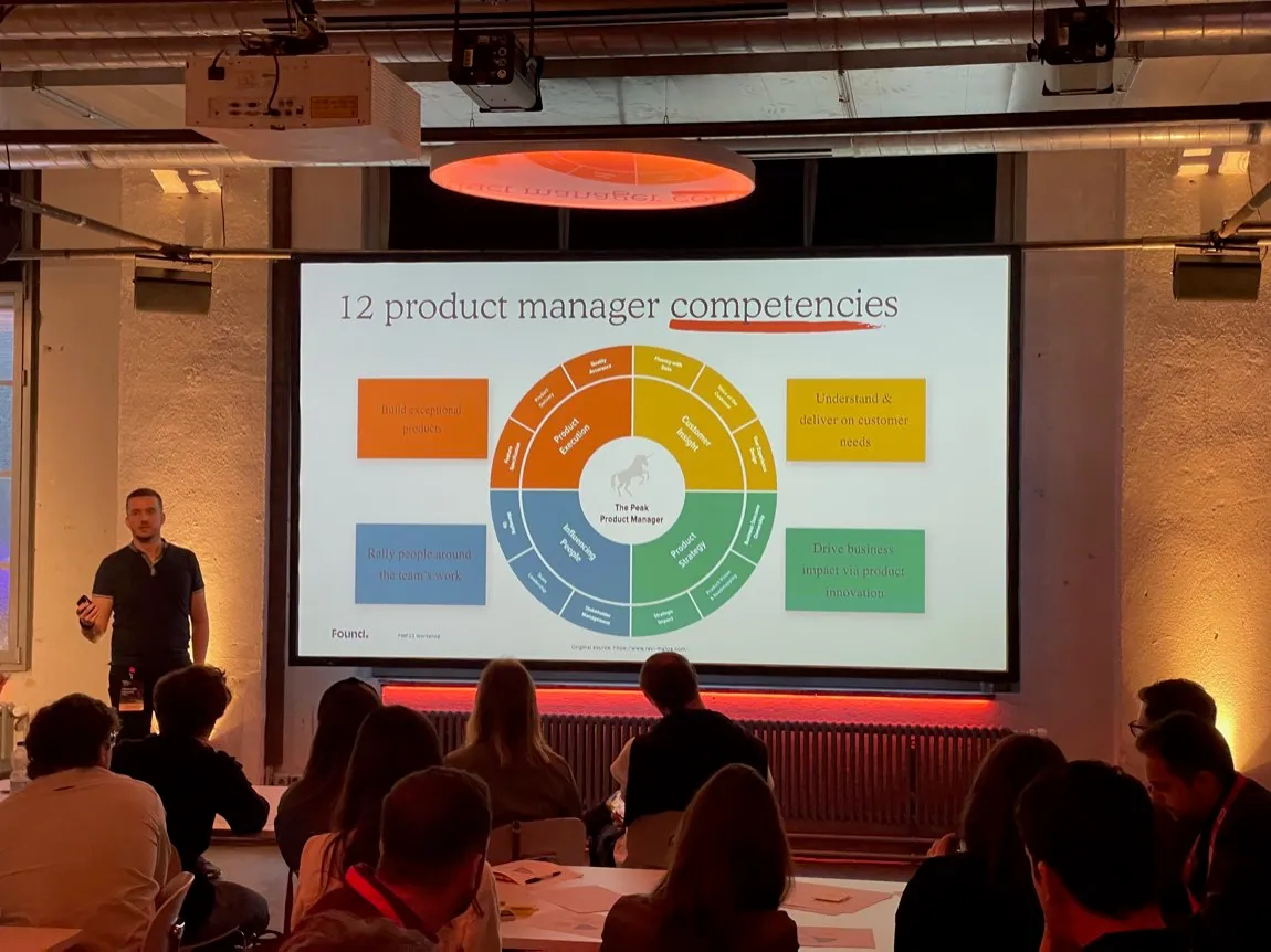 Olek presenting product management competencies at Product Management Festival Zurich